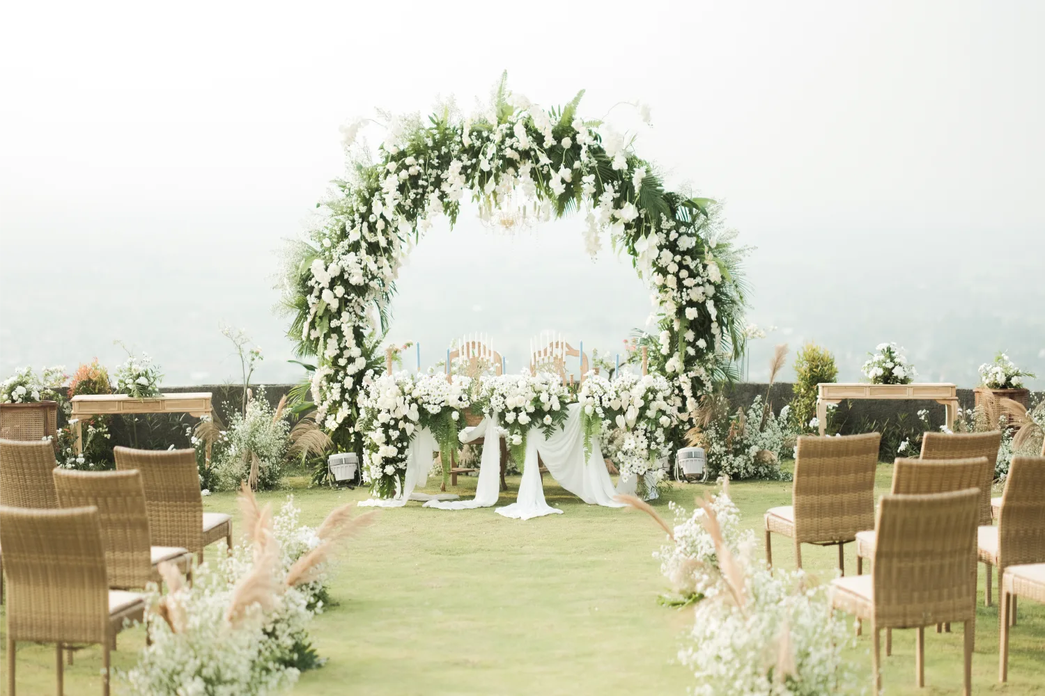 Outdoor wedding venue at the Amaranta Prambanan five-star hotel with Prambanan Temple and Mount Merapi as backdrop