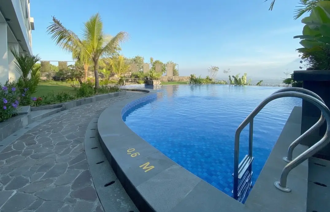 Panoramic pool at Amaranta Prambanan 5-star hotel with Merapi and Prambanan Temple views